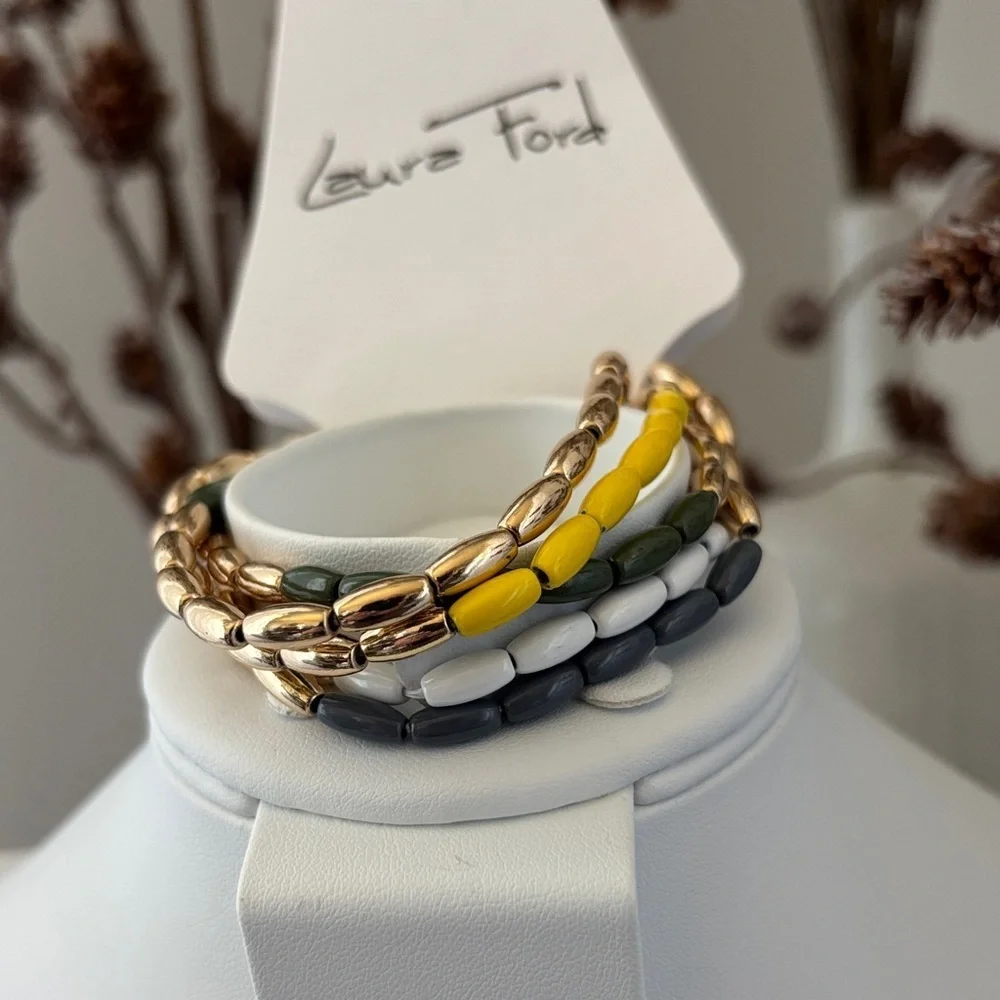 Laura Ford Goldtone 5 Row Rice bead yellow,green, blues & white,chunky stretch
